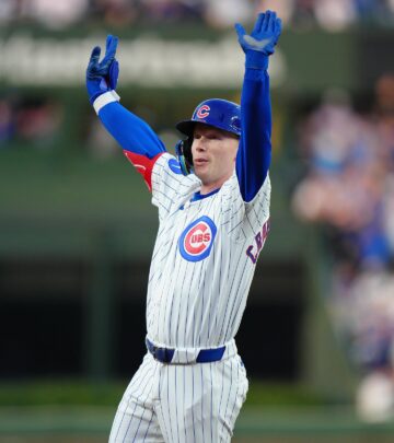 The outfielder brings energy to iconic ballpark as Cubs celebrate with enthusiastic shoutout.